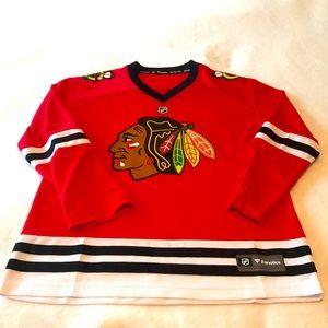 Brand new never worn Chicago Blackhawks Hockey jersey. Youth boys size XL & Red.